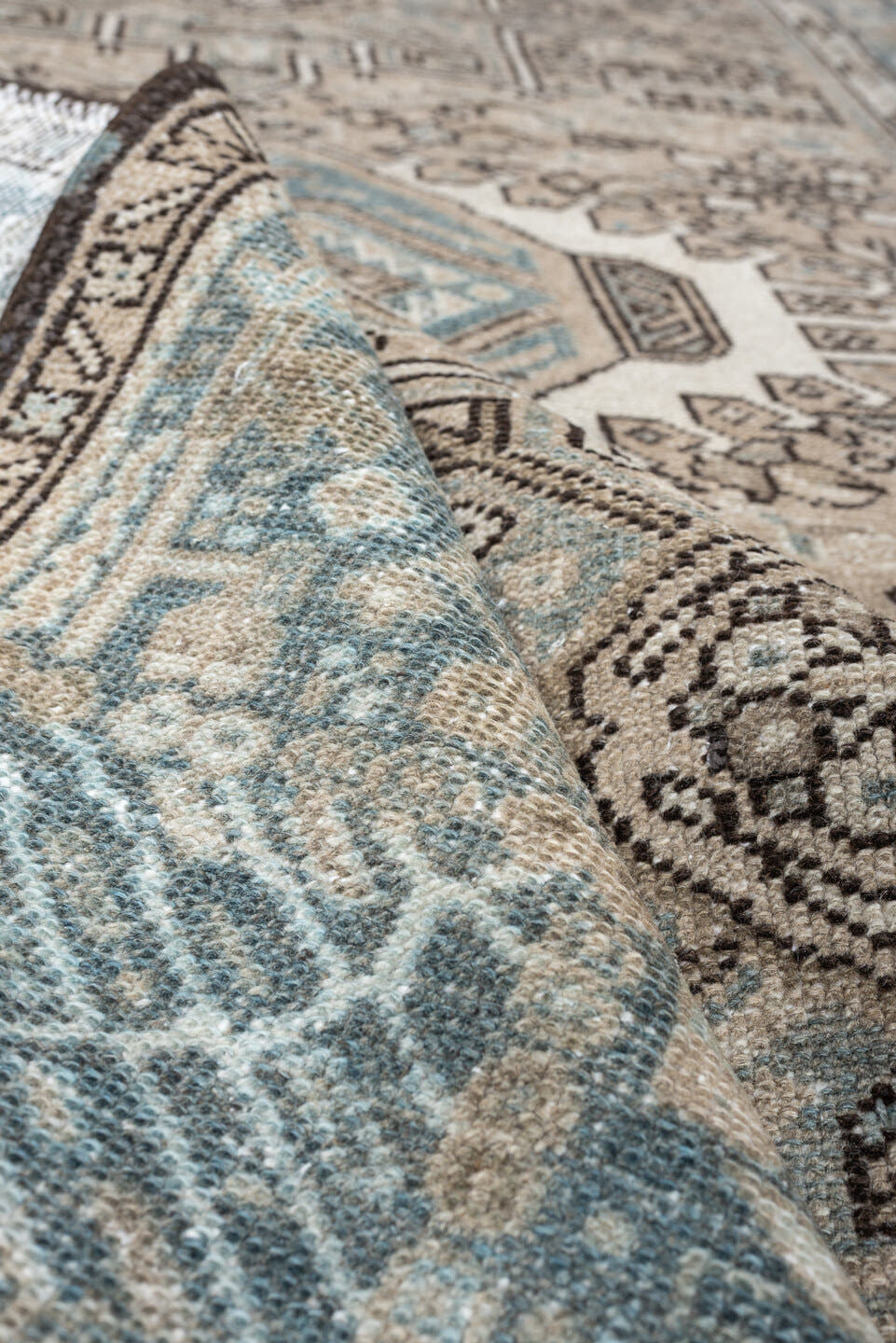 4' x 6' one-of-a-kind handmade antique Karaje rug. Color palette: ivory, powder blue, taupe, charcoal, brown, slate, cream