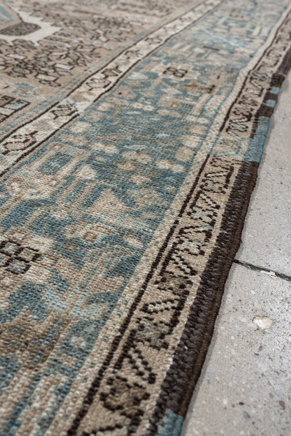 4' x 6' one-of-a-kind handmade antique Karaje rug. Color palette: ivory, powder blue, taupe, charcoal, brown, slate, cream