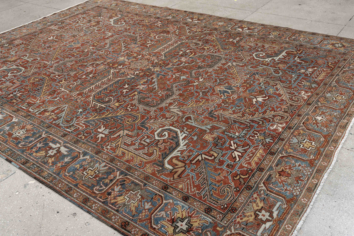 8' x 11' one-of-a-kind handmade antique Heriz large size rug. Color palette: rust, slate blue, ivory, camel, charcoal