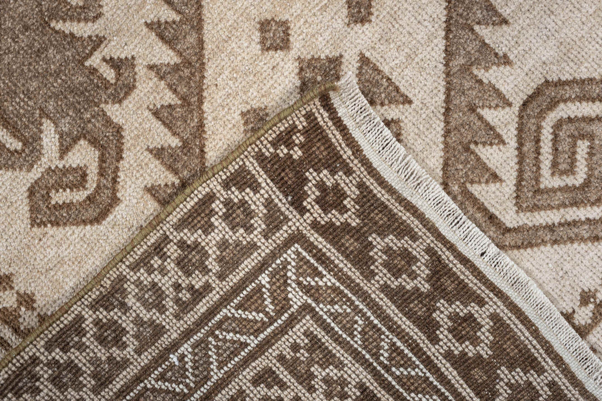 2' x 4' one-of-a-kind handmade antique Belouch small size rug. Color palette: ivory, taupe, camel, brown, beige, gray