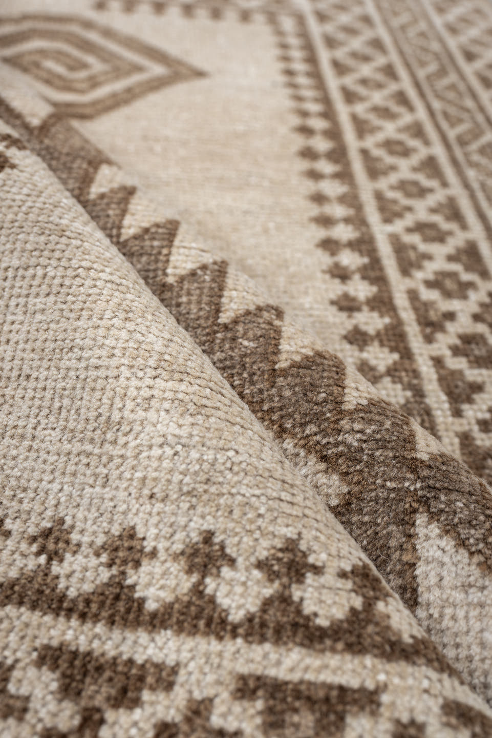 2' x 4' one-of-a-kind handmade antique Belouch small size rug. Color palette: ivory, taupe, camel, brown, beige, gray