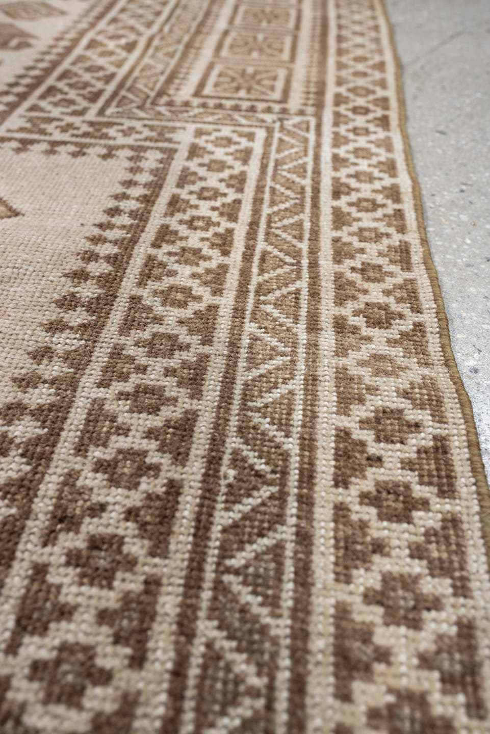 2' x 4' one-of-a-kind handmade antique Belouch small size rug. Color palette: ivory, taupe, camel, brown, beige, gray