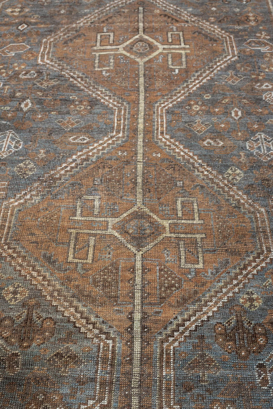 6' x 10' one-of-a-kind handmade antique Shiraz large size rug. Color palette: blue gray, rust, ivory, taupe, charcoal, camel