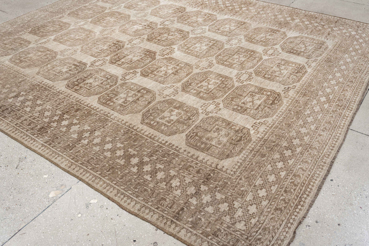 8' x 9' one-of-a-kind handmade antique Afghan large size rug. Color palette: ivory, taupe, sand, camel, beige, brown, gray