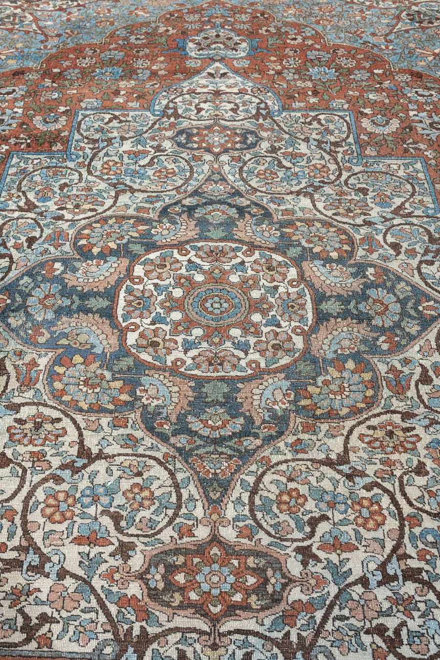 7' x 10' one-of-a-kind handmade antique Baktiary large size rug. Color palette: terracotta, ivory, turquoise, rust