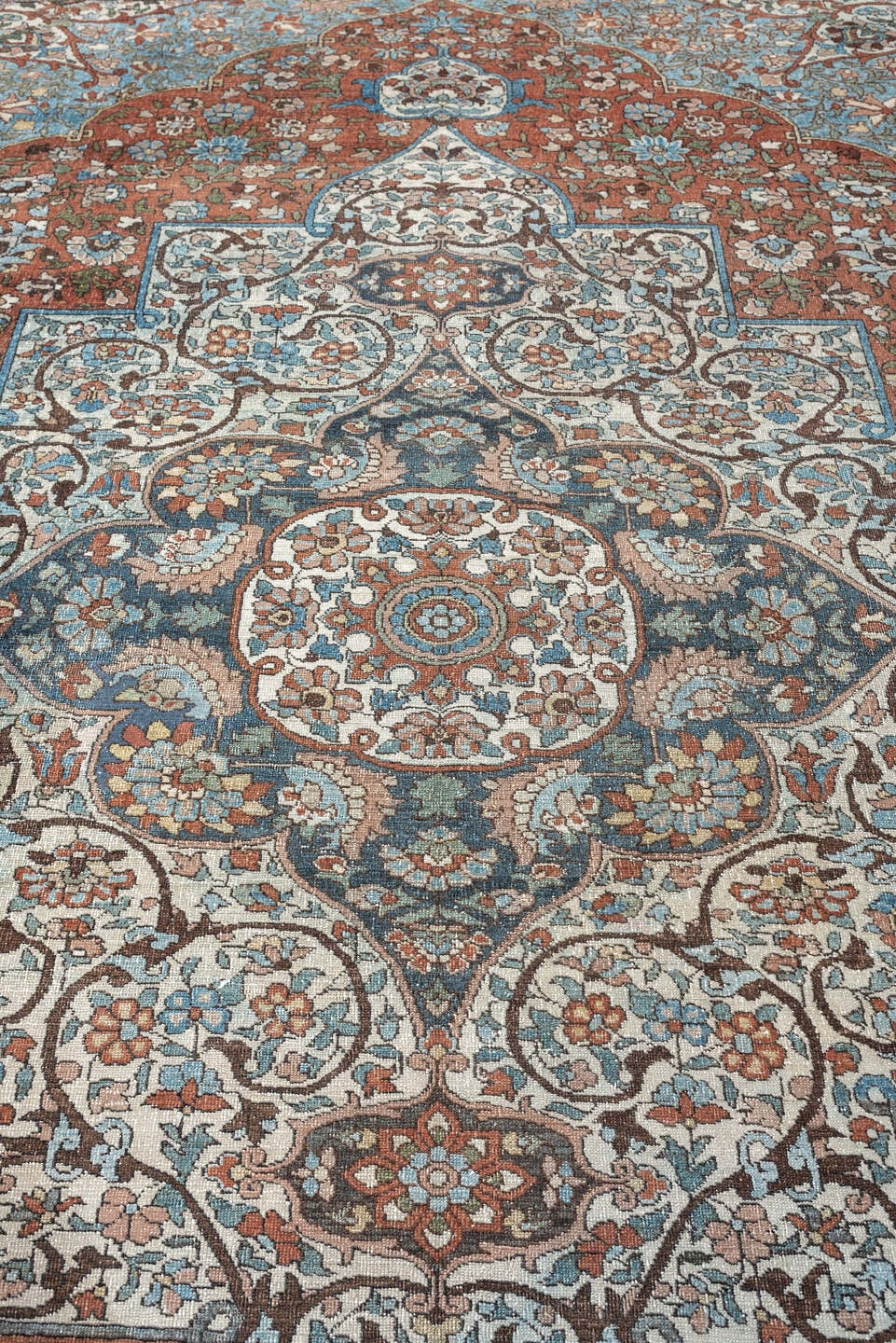 7' x 10' one-of-a-kind handmade antique Baktiary large size rug. Color palette: terracotta, ivory, turquoise, rust