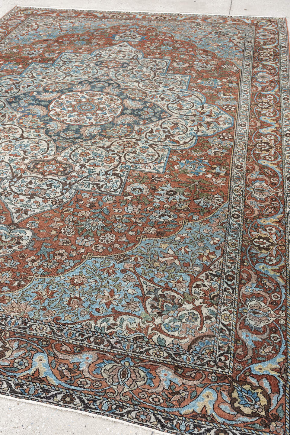 7' x 10' one-of-a-kind handmade antique Baktiary large size rug. Color palette: terracotta, ivory, turquoise, rust