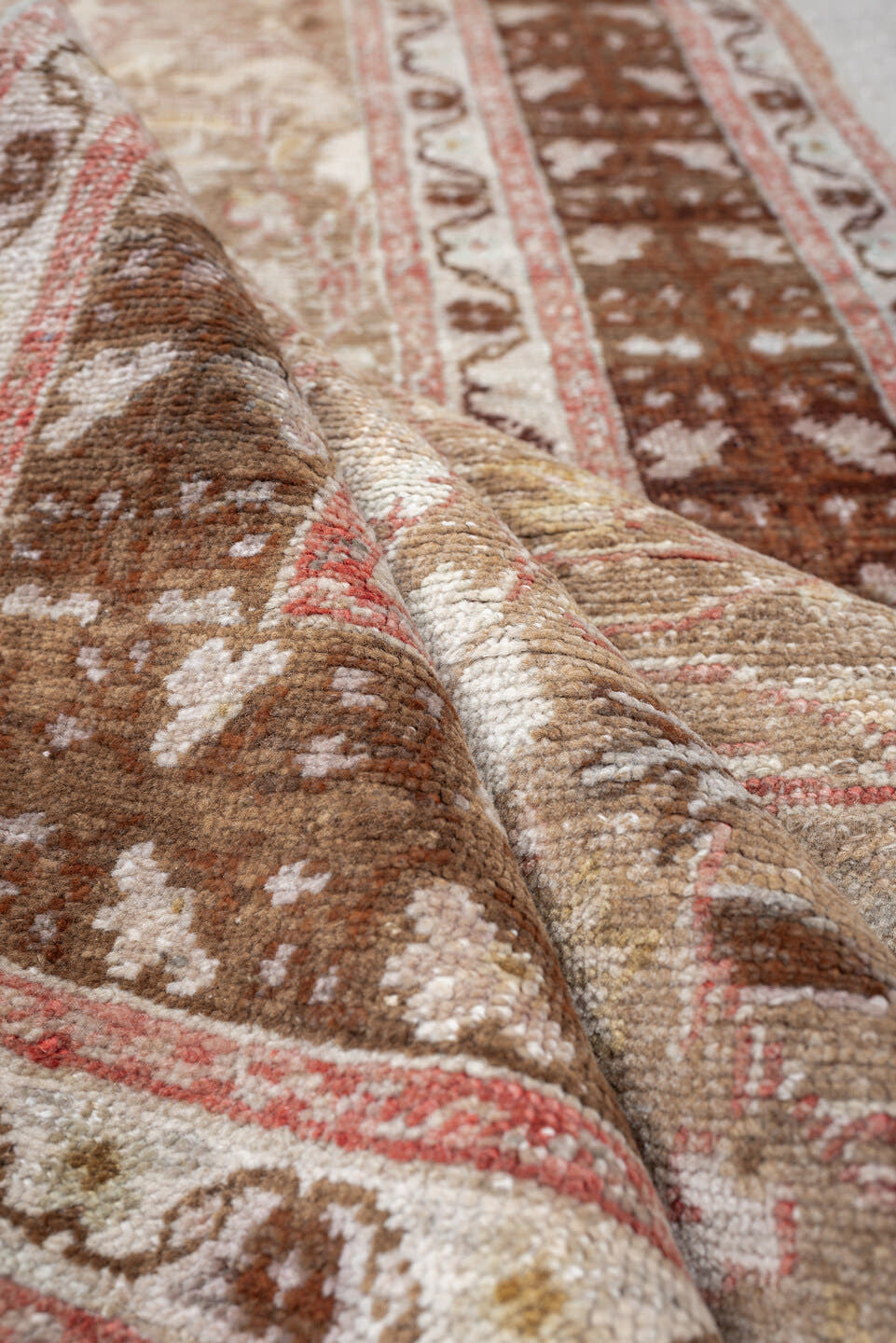 3' x 8' one-of-a-kind handmade antique Anatolian runner rug. Color palette: taupe, walnut brown, ivory, beige, rose