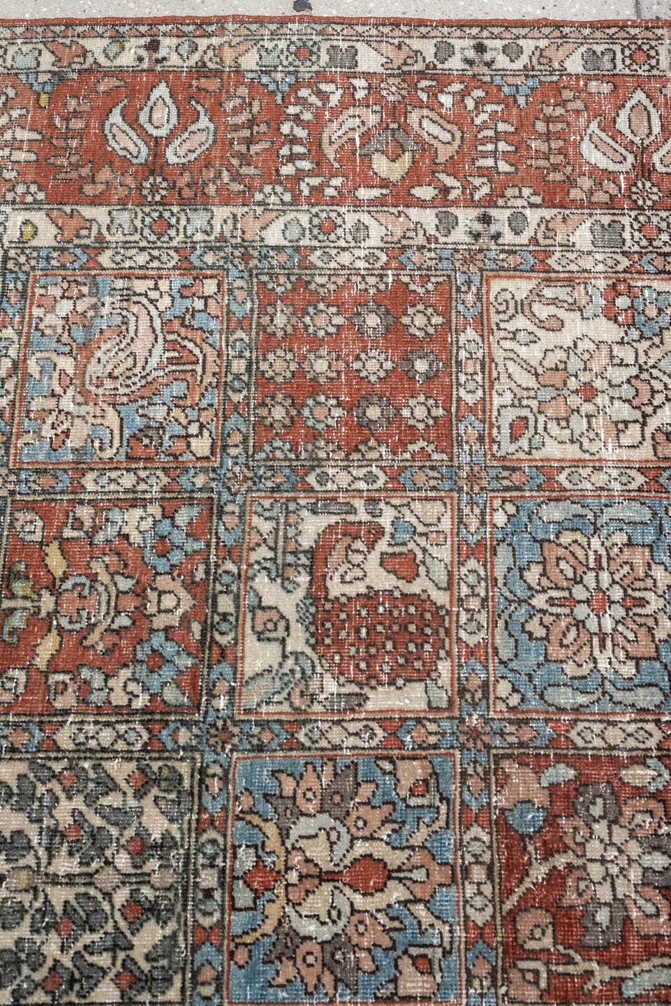 5' x 8' one-of-a-kind handmade antique Baktiary medium size rug. Color palette: terracotta, ivory, charcoal, slate blue