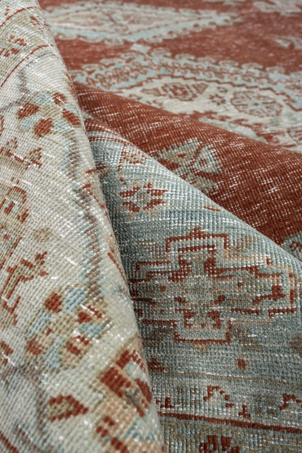8' x 7' one-of-a-kind handmade antique Veece rug. Color palette: terracotta, ivory, pale blue gray, rust, taupe, sage, coral