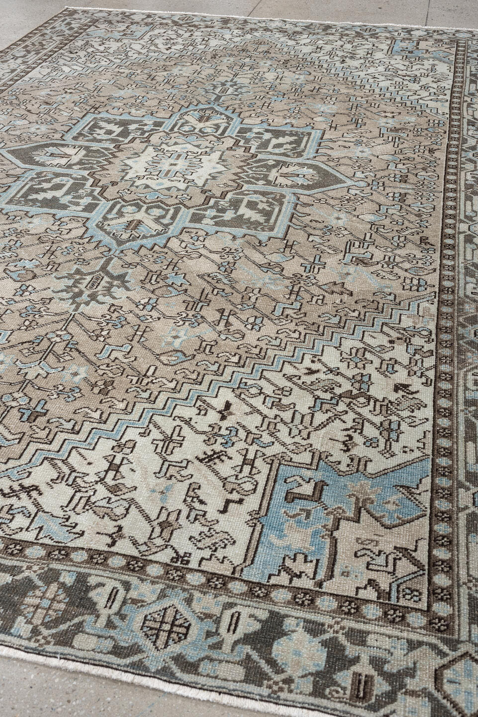 7' x 11' one-of-a-kind handmade antique Heriz large size rug. Color palette: ivory, taupe, charcoal, slate blue, dark brown