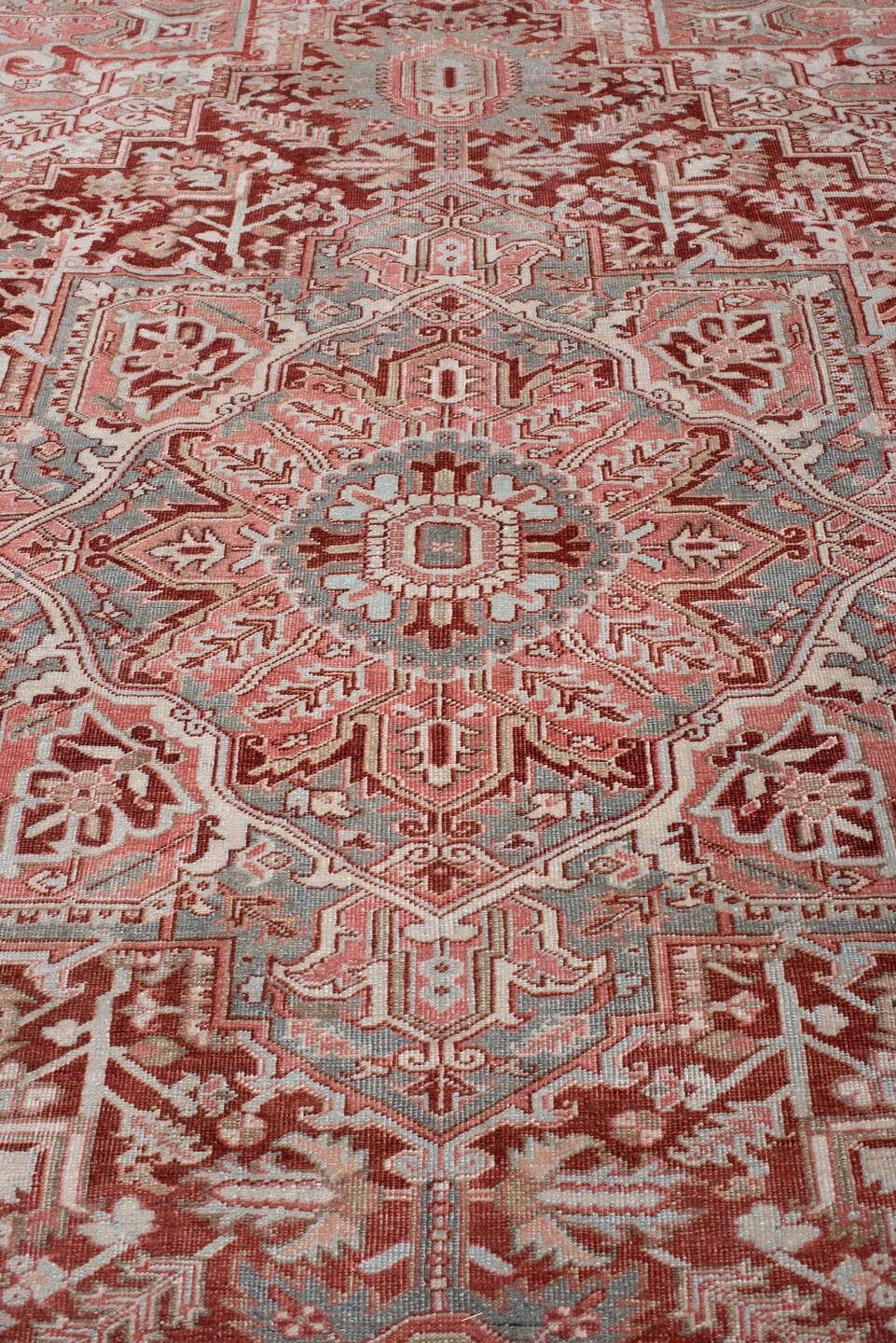 7' x 10' one-of-a-kind handmade antique Heriz large size rug. Color palette: brick red, blue gray, ivory, rose, taupe