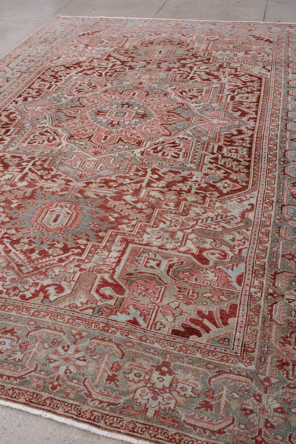 7' x 10' one-of-a-kind handmade antique Heriz large size rug. Color palette: brick red, blue gray, ivory, rose, taupe