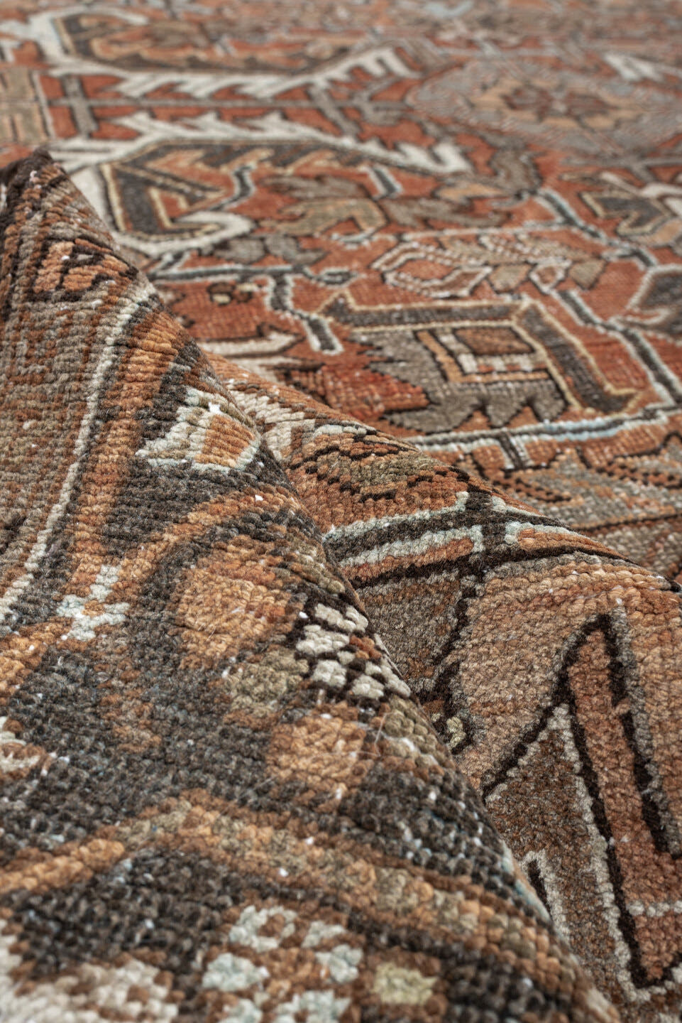 6' x 8' one-of-a-kind handmade antique Heriz medium size rug. Color palette: terracotta, charcoal, ivory, taupe, sage, slate