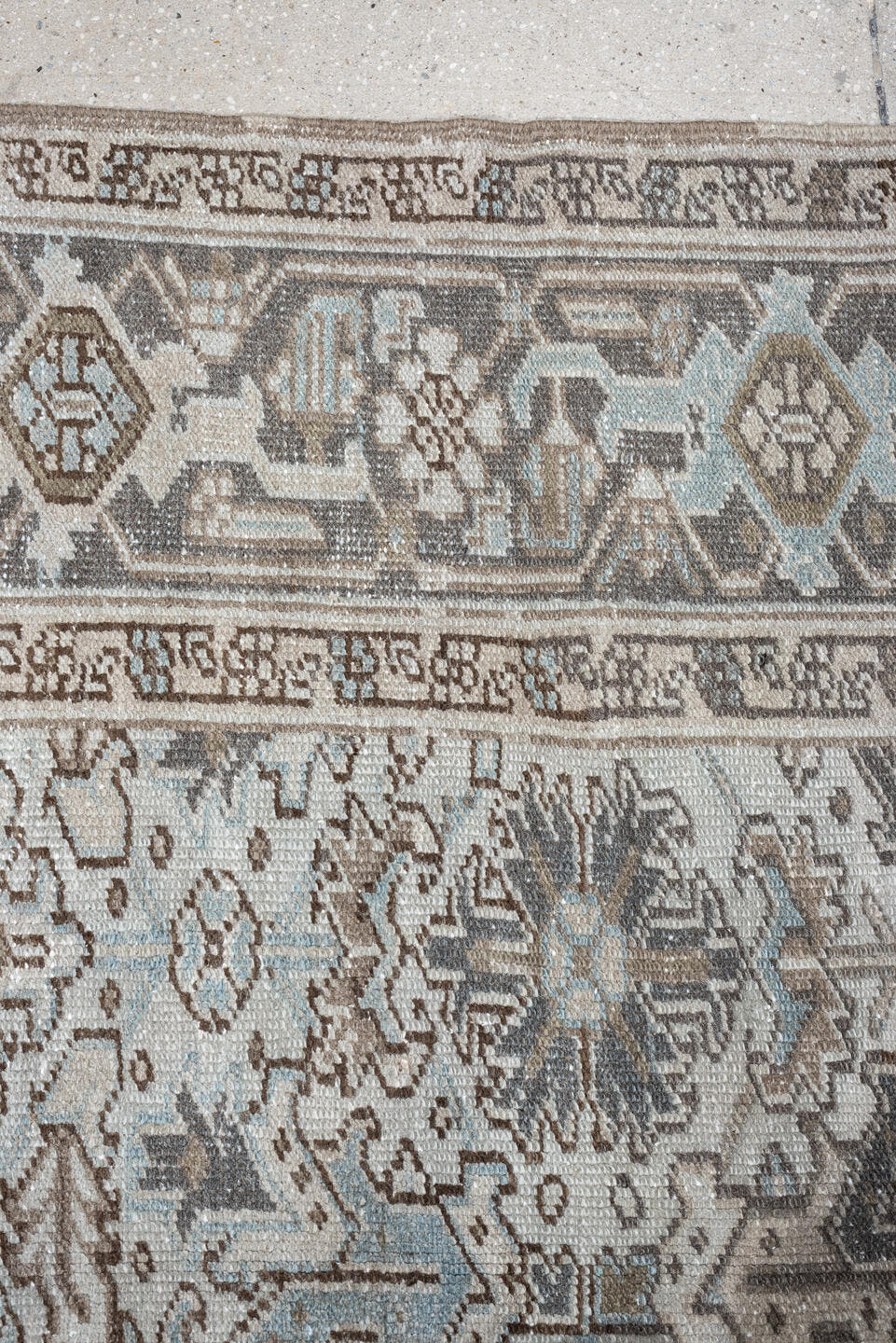 7' x 10' one-of-a-kind handmade antique Heriz large size rug. Color palette: ivory, taupe, charcoal, pale blue, brown, gray