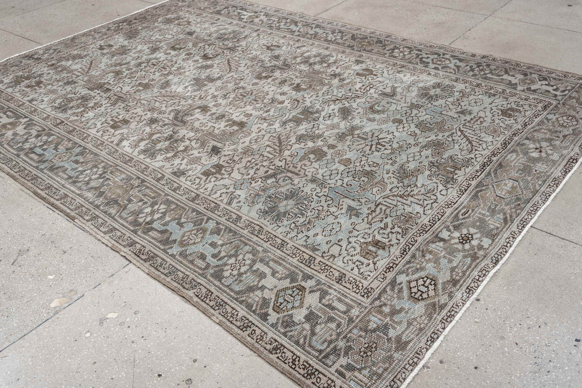 7' x 10' one-of-a-kind handmade antique Heriz large size rug. Color palette: ivory, taupe, charcoal, pale blue, brown, gray