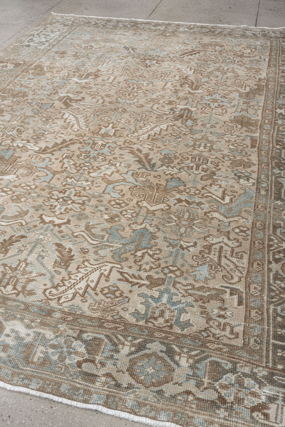7' x 10' one-of-a-kind handmade antique Heriz large size rug. Color palette: taupe, brown, ivory, pale blue, charcoal, slate