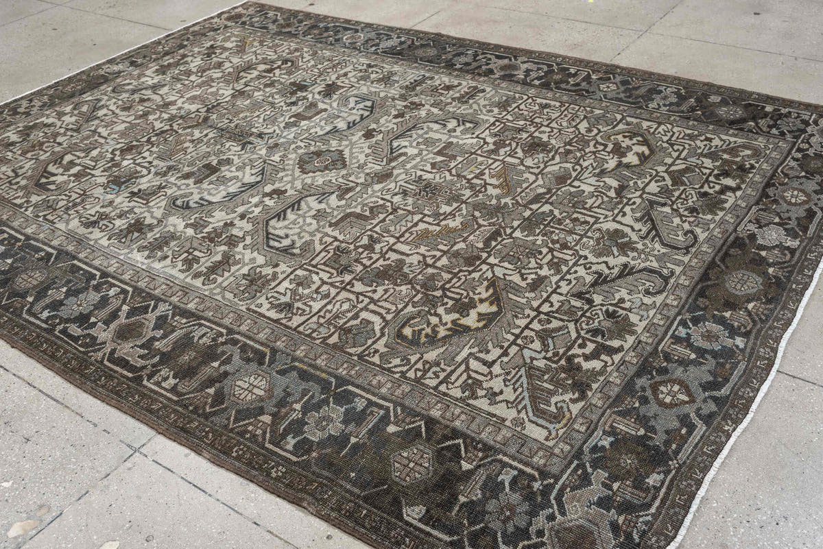 7' x 9' one-of-a-kind handmade antique Heriz large size rug. Color palette: ivory, charcoal, taupe, slate blue, olive, camel