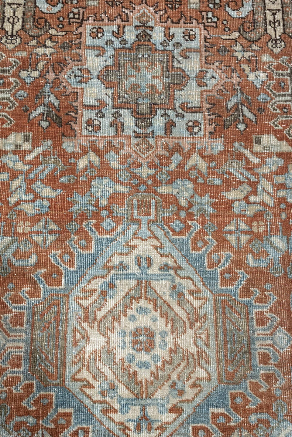 7' x 9' one-of-a-kind handmade antique Heriz large size rug. Color palette: rust, blue gray, ivory, terra cotta, charcoal