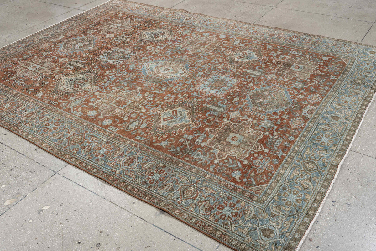 7' x 9' one-of-a-kind handmade antique Heriz large size rug. Color palette: rust, blue gray, ivory, terra cotta, charcoal