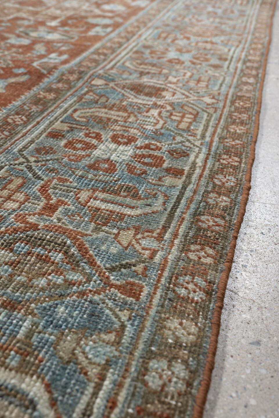 7' x 9' one-of-a-kind handmade antique Heriz large size rug. Color palette: rust, blue gray, ivory, terra cotta, charcoal