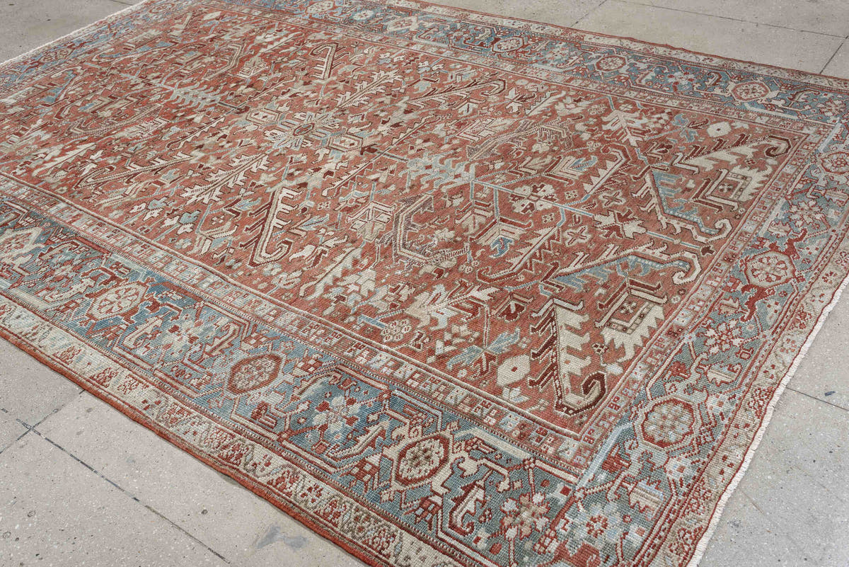7' x 10' one-of-a-kind handmade antique Heriz large size rug. Color palette: terra cotta, ivory, blue gray, rust, pale blue