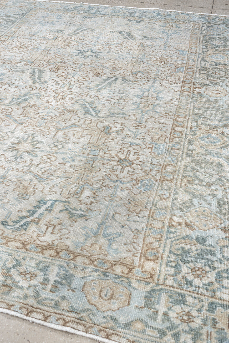 7' x 8' one-of-a-kind handmade antique Heriz rug. Color palette: ivory, pale blue, sage, taupe, blue gray, beige, charcoal