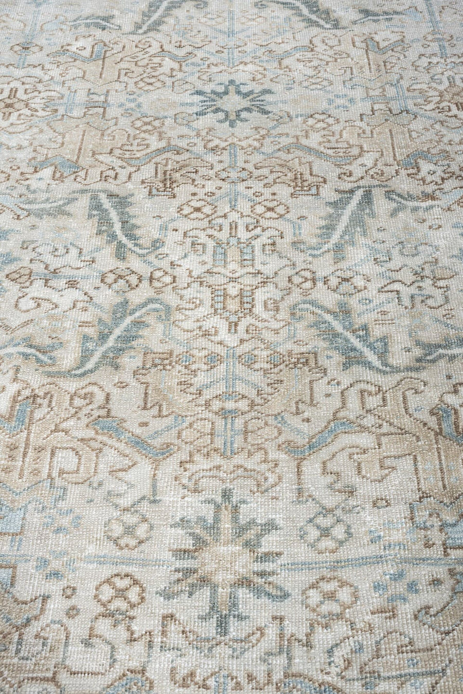 7' x 8' one-of-a-kind handmade antique Heriz rug. Color palette: ivory, pale blue, sage, taupe, blue gray, beige, charcoal