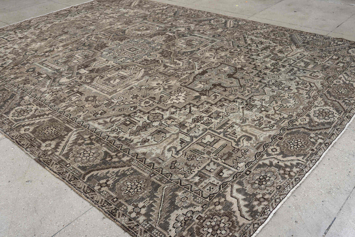9' x 13' one-of-a-kind handmade antique Heriz large size rug. Color palette: taupe, ivory, charcoal, brown, slate, camel