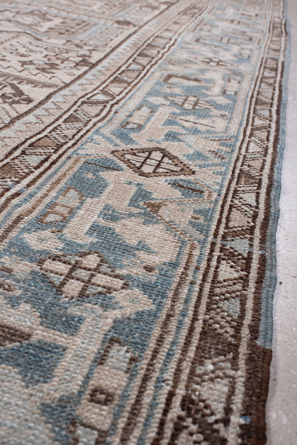 7' x 11' one-of-a-kind handmade antique Heriz large size rug. Color palette: ivory, blue gray, taupe, chocolate brown, slate