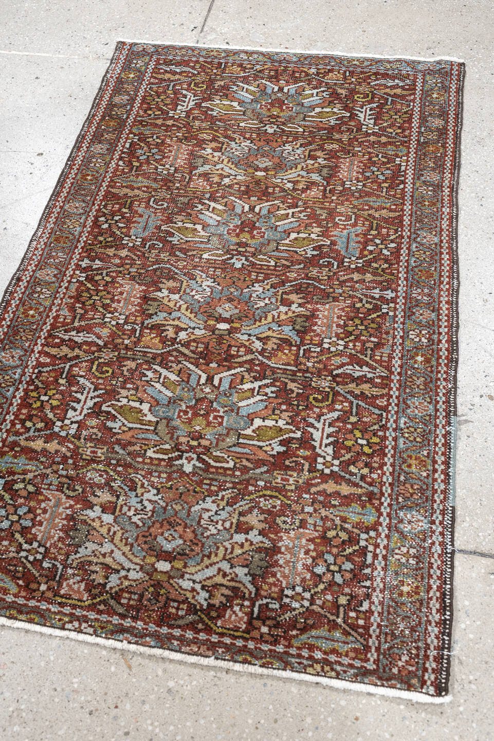 7' x 10' one-of-a-kind handmade antique Heriz large size rug. Color palette: rust, powder blue, ivory, olive, rose, charcoal