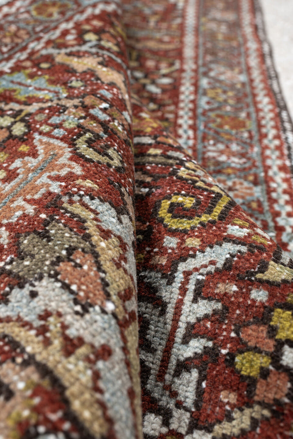 7' x 10' one-of-a-kind handmade antique Heriz large size rug. Color palette: rust, powder blue, ivory, olive, rose, charcoal