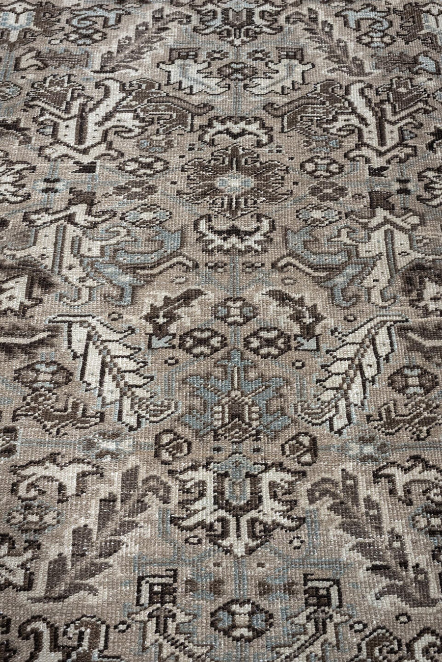 7' x 9' one-of-a-kind handmade antique Heriz large size rug. Color palette: ivory, taupe, charcoal, pale blue, gray, brown