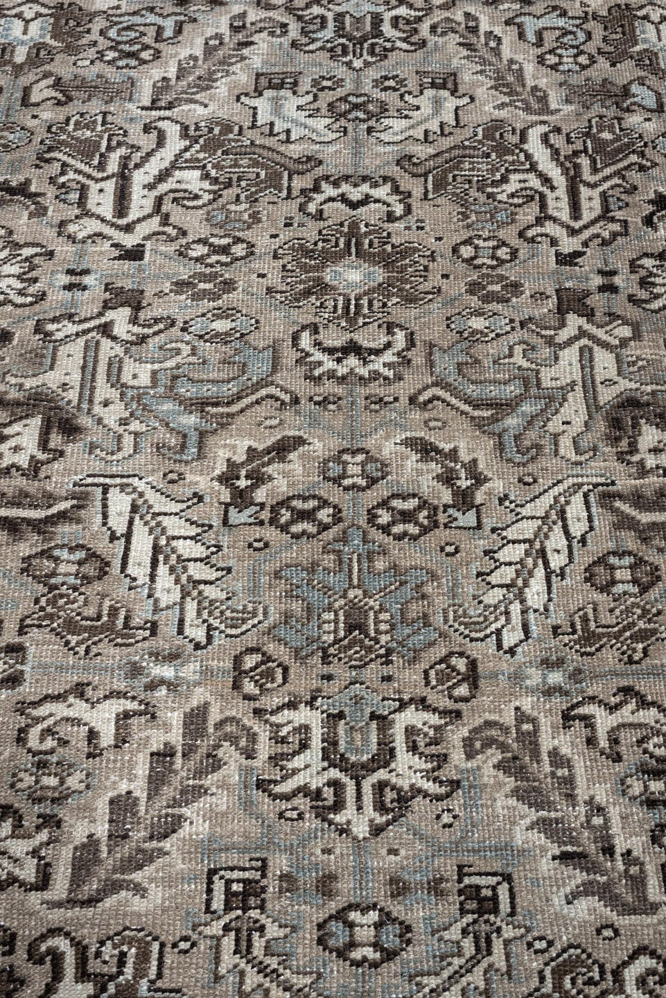 7' x 9' one-of-a-kind handmade antique Heriz large size rug. Color palette: ivory, taupe, charcoal, pale blue, gray, brown
