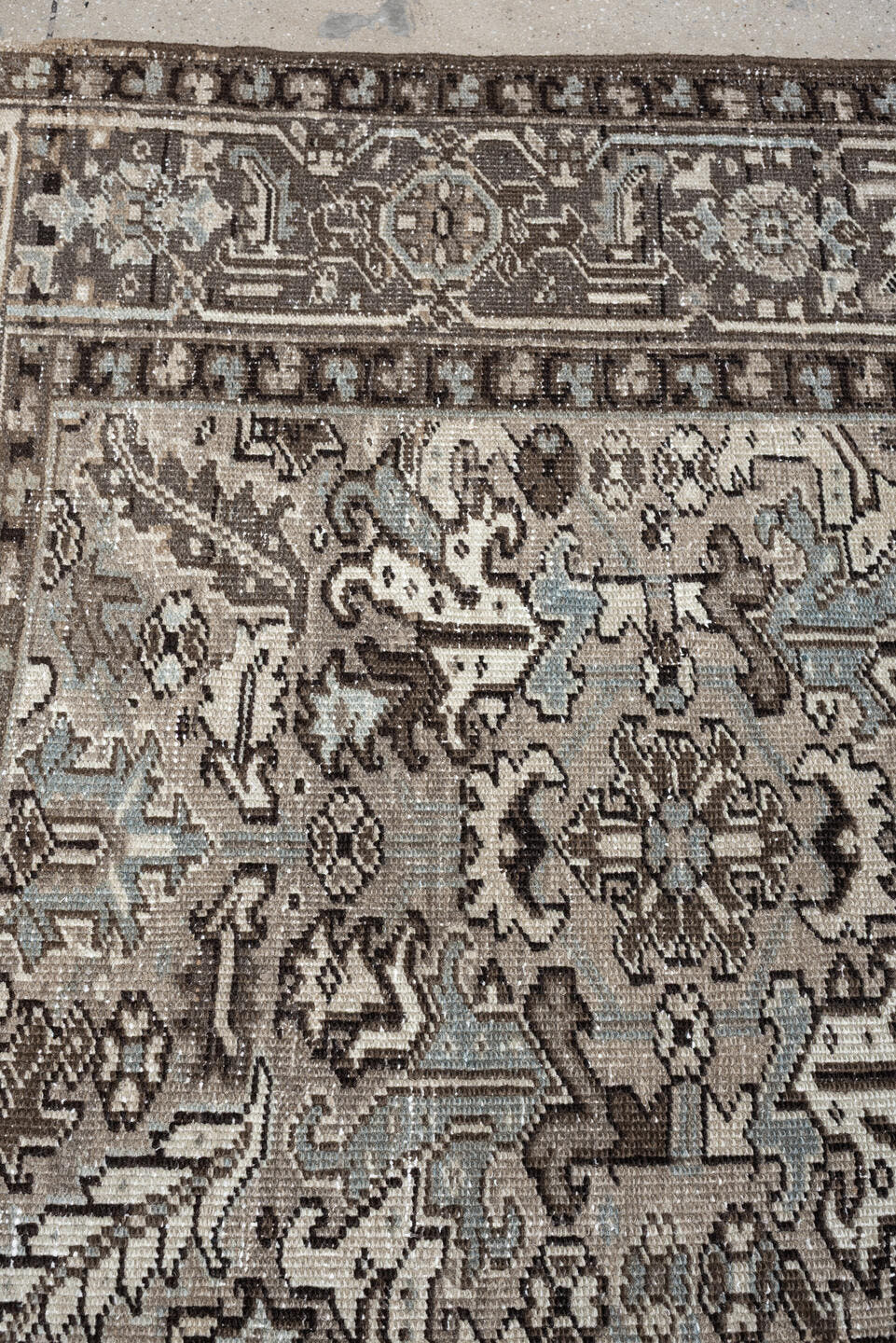 7' x 9' one-of-a-kind handmade antique Heriz large size rug. Color palette: ivory, taupe, charcoal, pale blue, gray, brown