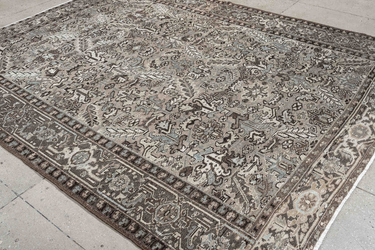 7' x 9' one-of-a-kind handmade antique Heriz large size rug. Color palette: ivory, taupe, charcoal, pale blue, gray, brown