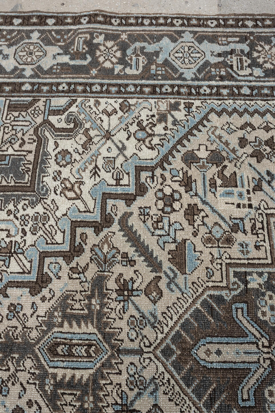 6' x 9' one-of-a-kind handmade antique Heriz medium size rug. Color palette: ivory, charcoal brown, pale blue, taupe, brown