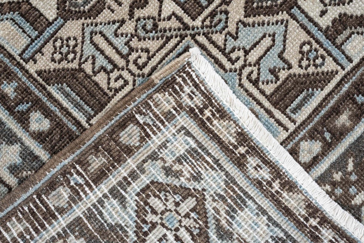 6' x 9' one-of-a-kind handmade antique Heriz medium size rug. Color palette: ivory, charcoal brown, pale blue, taupe, brown