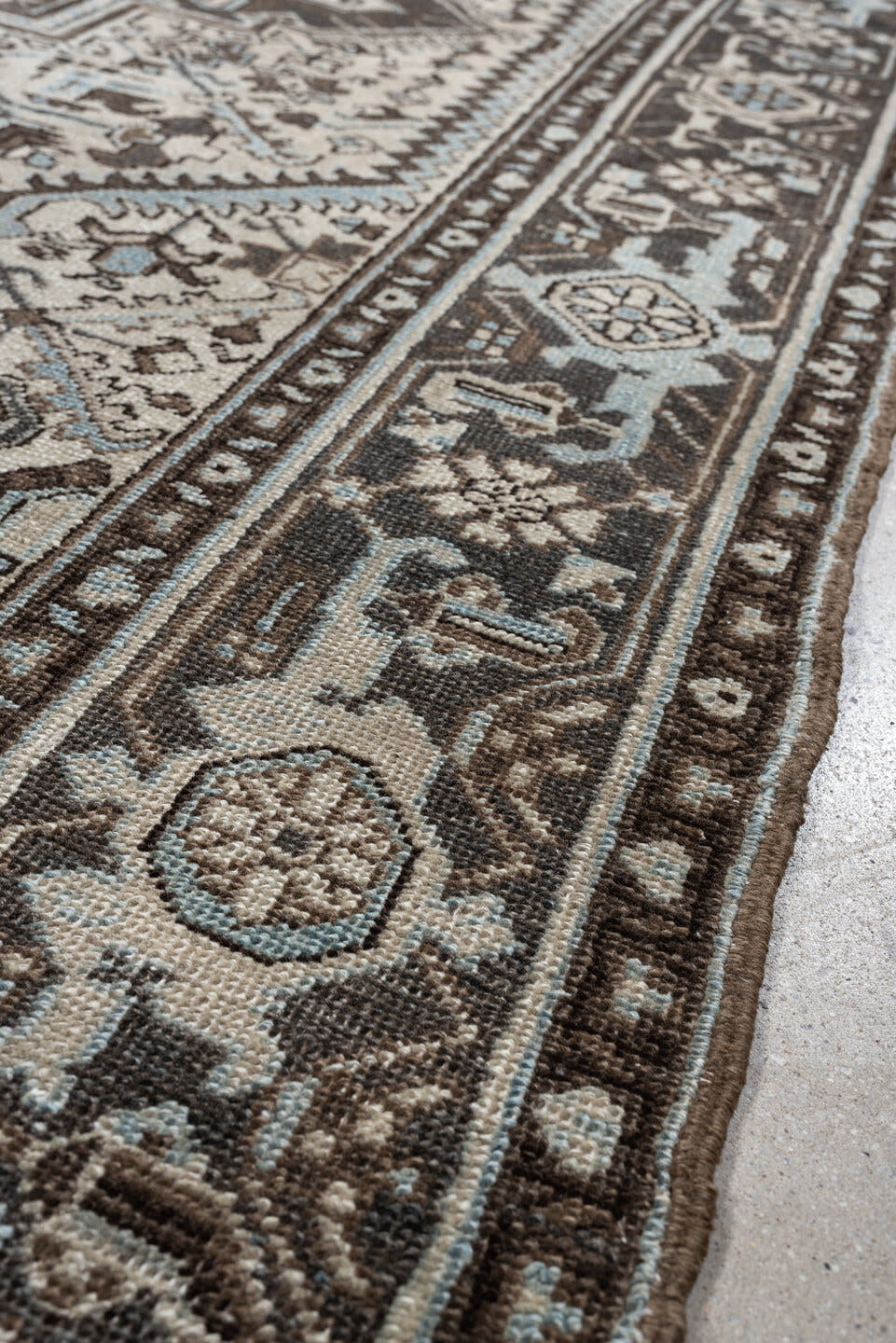 6' x 9' one-of-a-kind handmade antique Heriz medium size rug. Color palette: ivory, charcoal brown, pale blue, taupe, brown