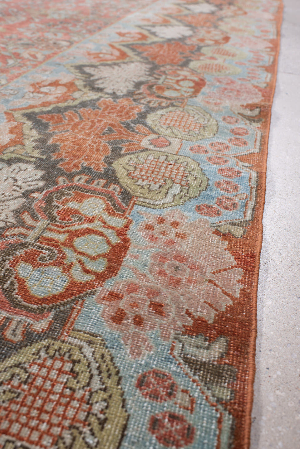 8' x 11' one-of-a-kind handmade antique Sarouk large size rug. Color palette: terracotta, powder blue, ivory, rust, charcoal