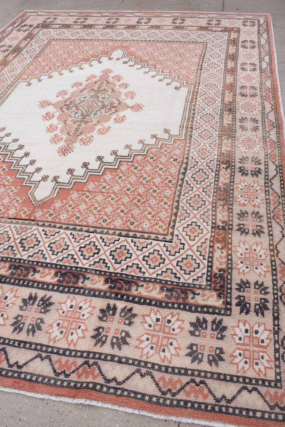 7' x 10' one-of-a-kind handmade antique Moroccan large size rug. Color palette: ivory, terracotta, charcoal, dark brown