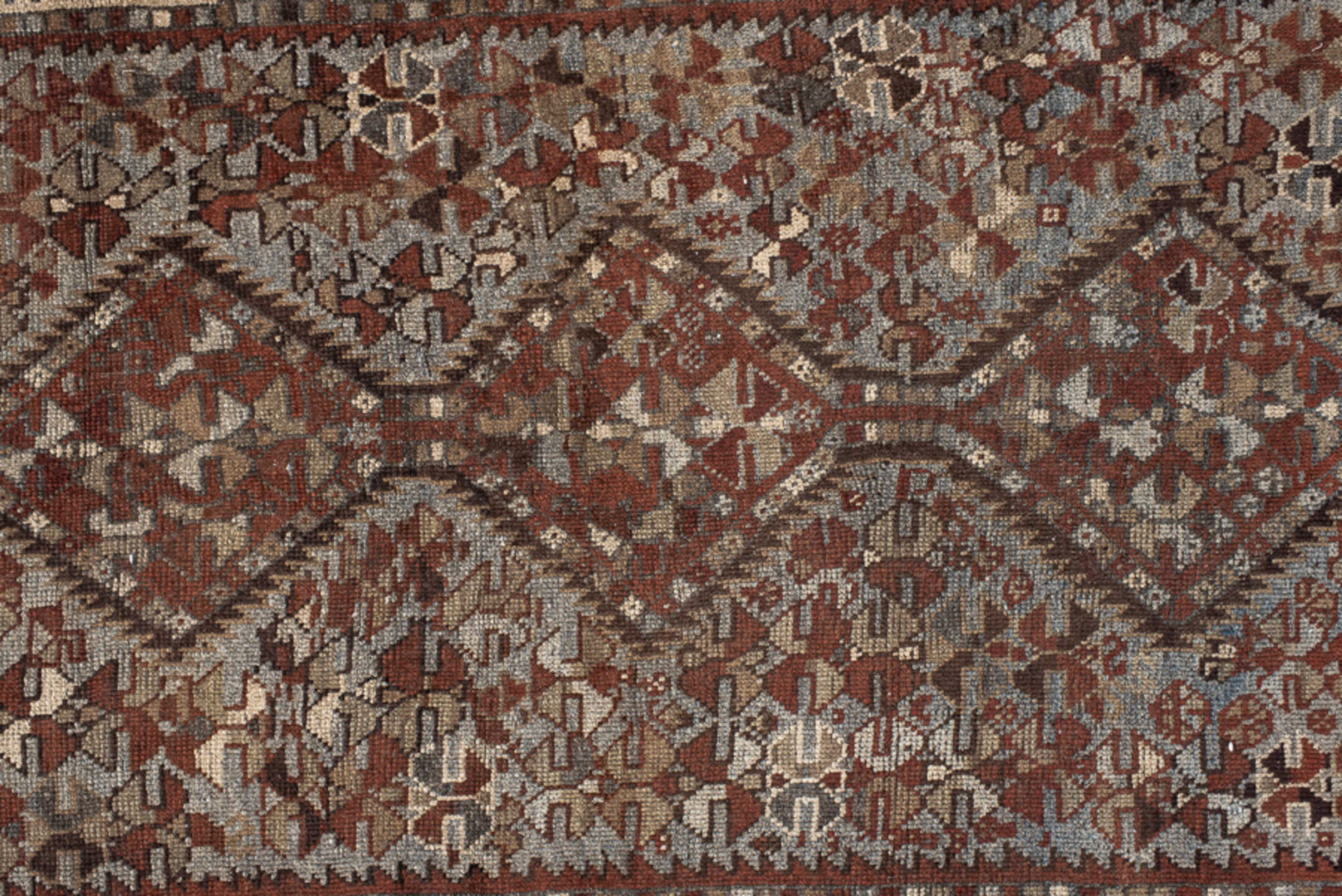 3' x 9' one-of-a-kind handmade vintage Shirvan runner rug. Color palette: rust, ivory, slate, brown, charcoal, taupe