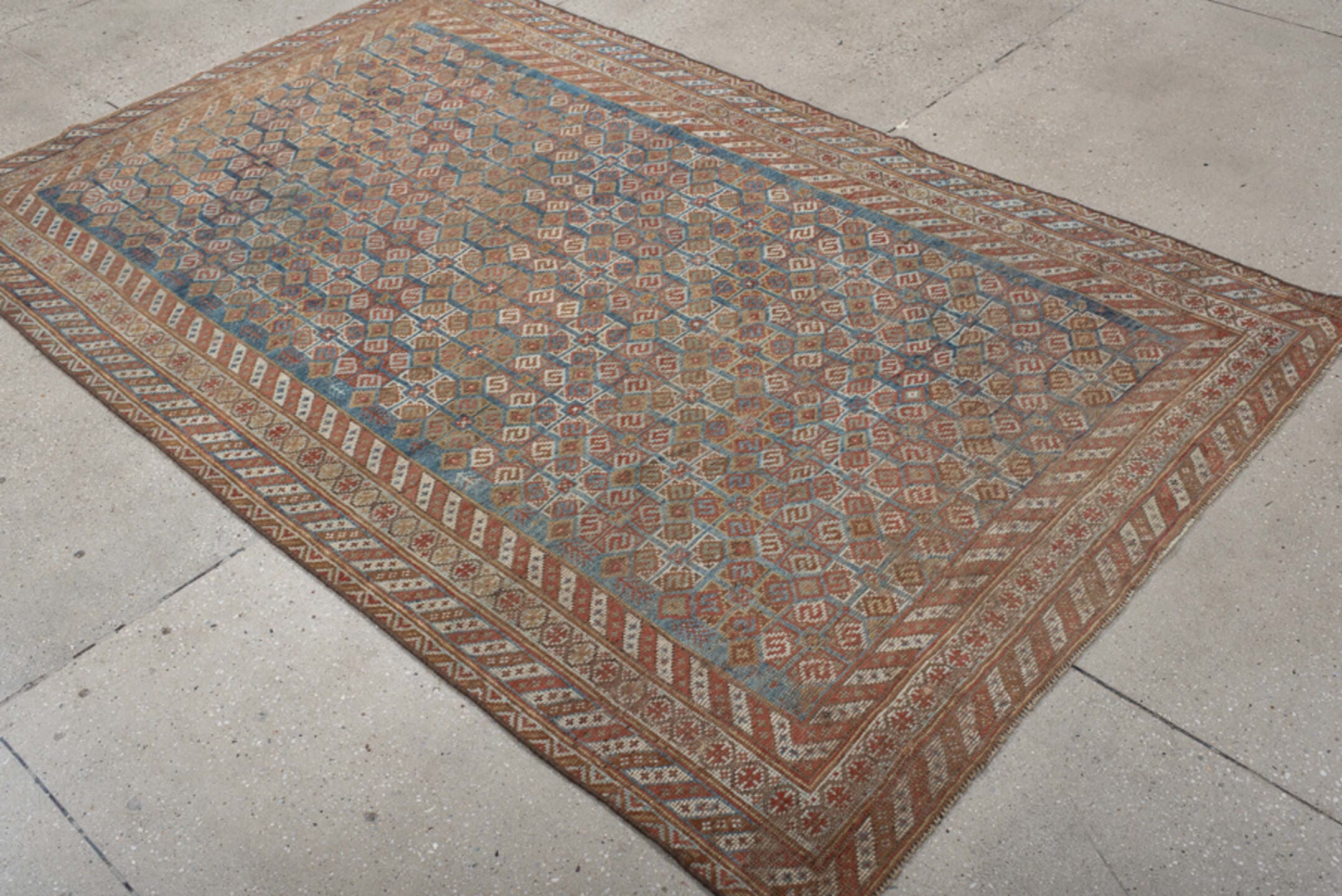 4' x 7' one-of-a-kind handmade vintage Shiraz rug. Color palette: terra cotta, camel, blue, ivory, rust, taupe, terracotta