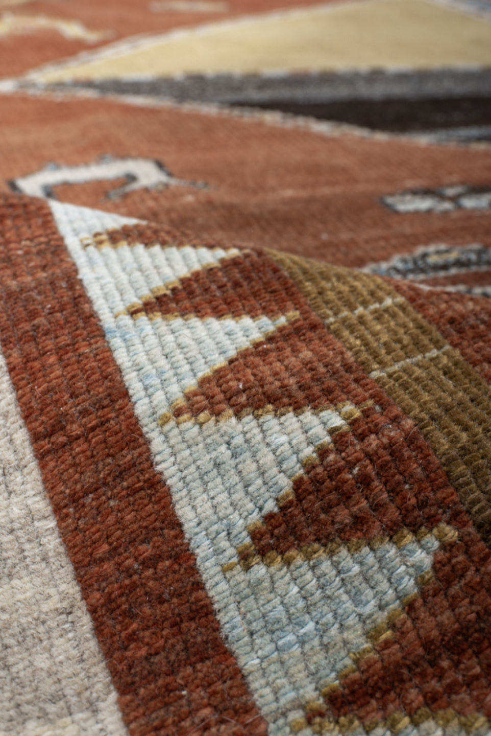 6' x 7' one-of-a-kind handmade vintage Gabbe rug. Color palette: rust, ivory, sky_blue, camel, charcoal, slate, olive