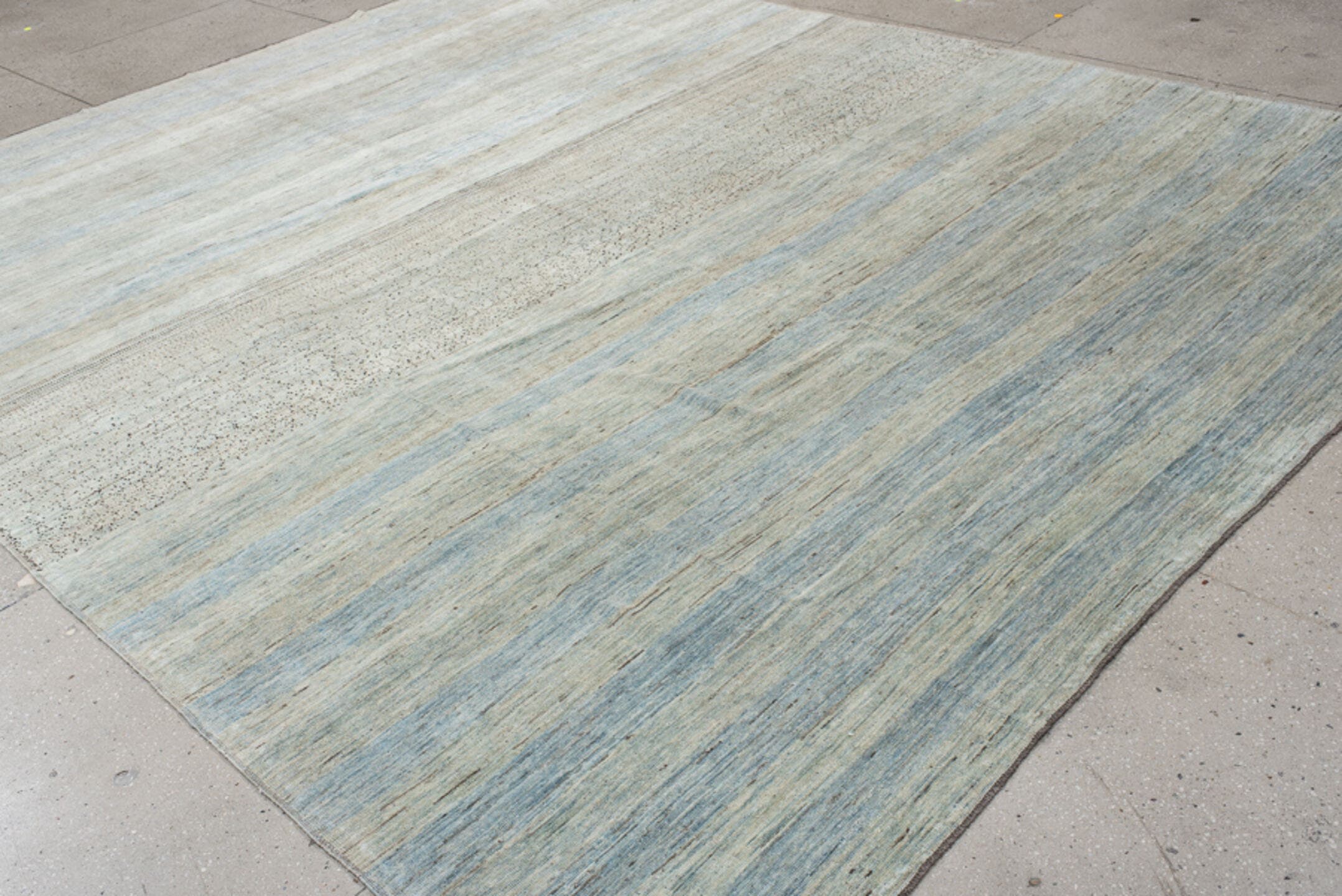 10' x 12' one-of-a-kind handmade vintage Gabbe large size rug. Color palette: ivory, pale blue, sky blue, beige, taupe