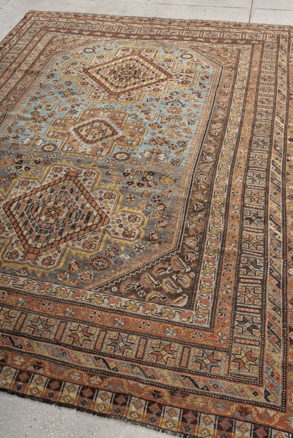 6' x 8' one-of-a-kind handmade vintage Shiraz medium size rug. Color palette: sky blue, rust, ivory, brown, camel, charcoal
