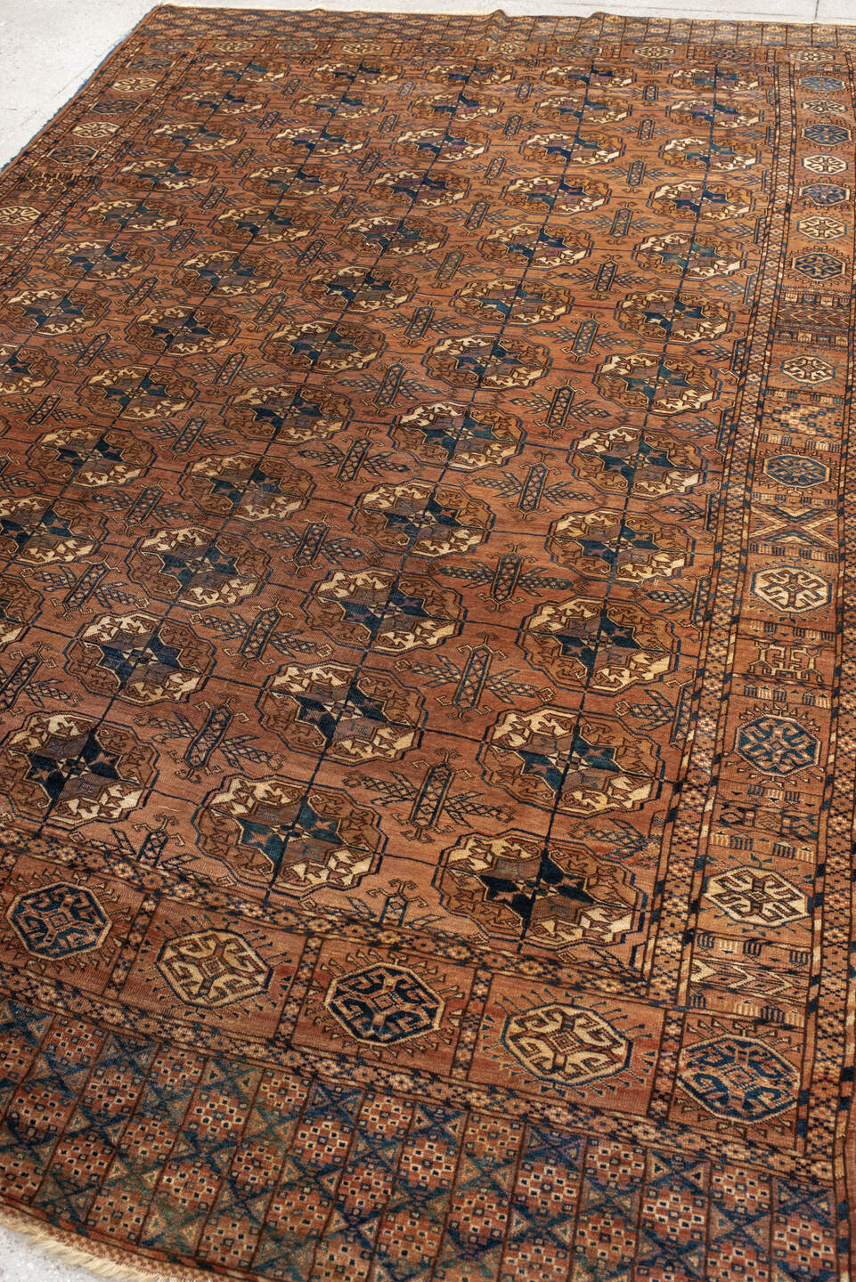 6' x 10' one-of-a-kind handmade antique Torkaman large size rug. Color palette: terra cotta, brown, navy, ivory, camel