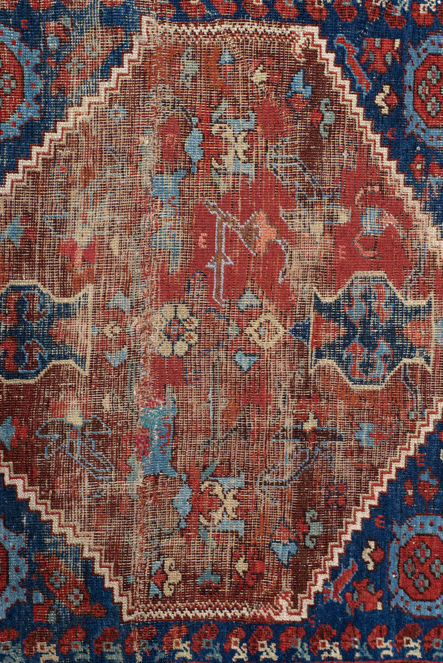 4' x 4' one-of-a-kind handmade antique Anatolian small size rug. Color palette: ivory, indigo, rust, sky_blue, brown