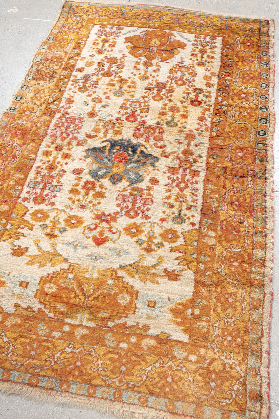 3' x 6' one-of-a-kind handmade antique Oushak rug. Color palette: apricot, ivory, rust, sky blue, slate, camel, terracotta