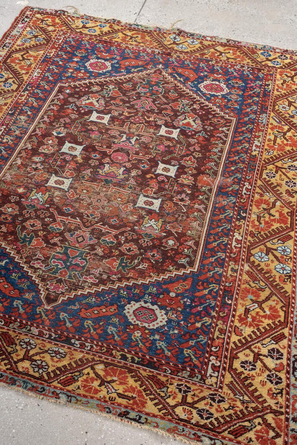 4' x 5' one-of-a-kind handmade vintage Anatolian small size rug. Color palette: rust, indigo, ivory, burgundy, sky blue